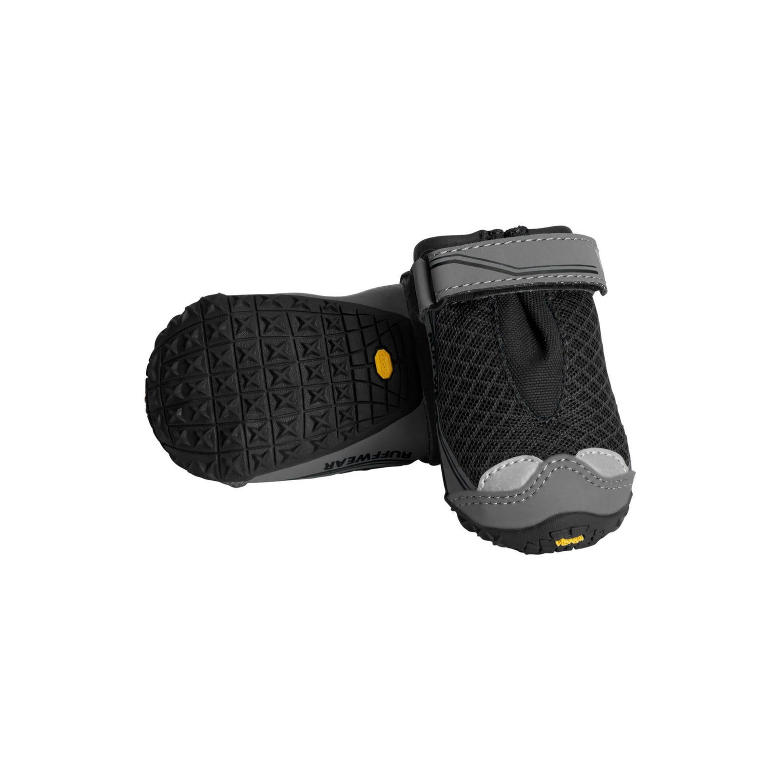 Pair of Ruffwear Grip Trex dog boots in Obsidian Black, one showing the textured Vibram sole and one upright showing the mesh upper, velcro strap, and toe bumper, on white background.