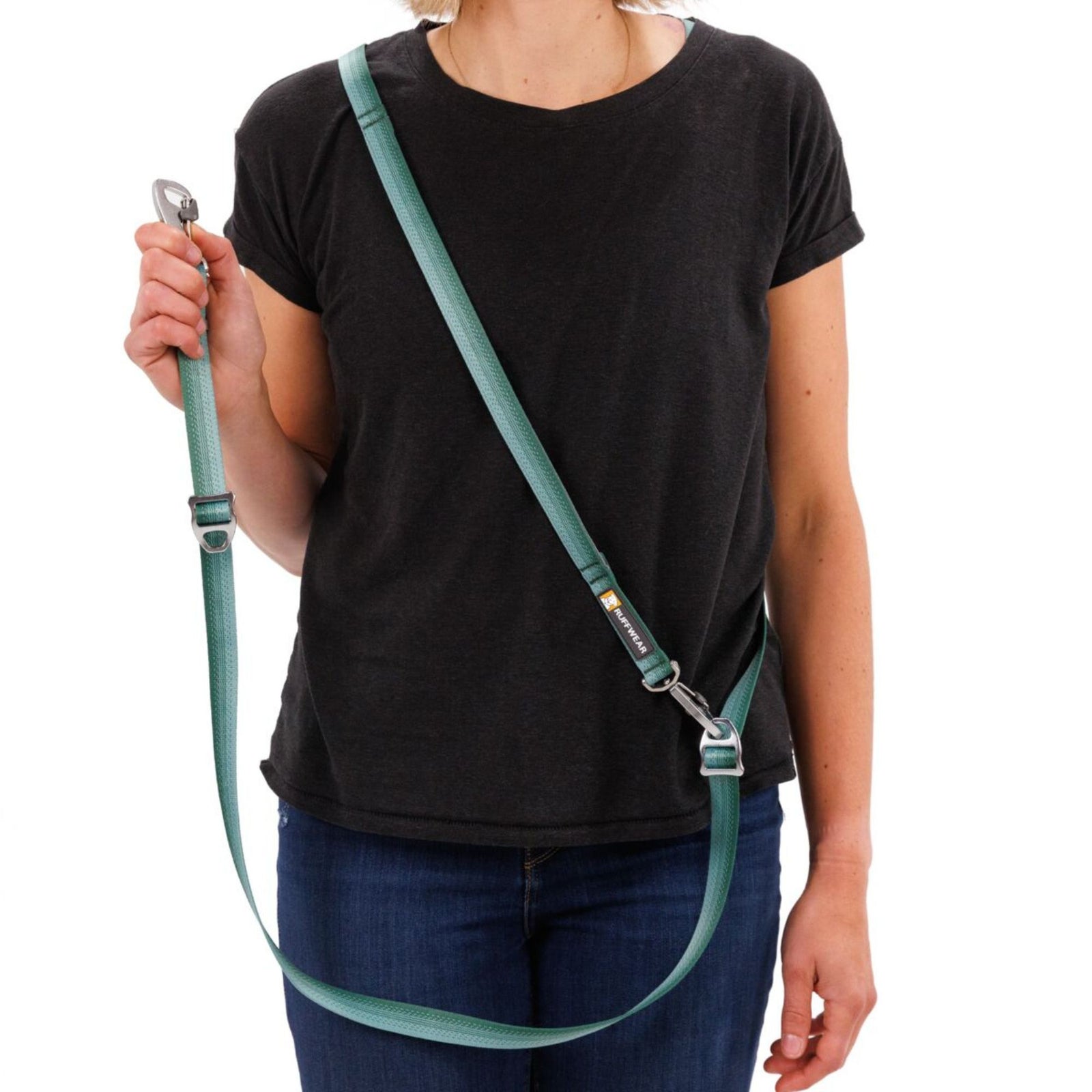 Person wearing Ruffwear Switchbak Double-Ended Dog Lead over the shoulder in River Rock Green