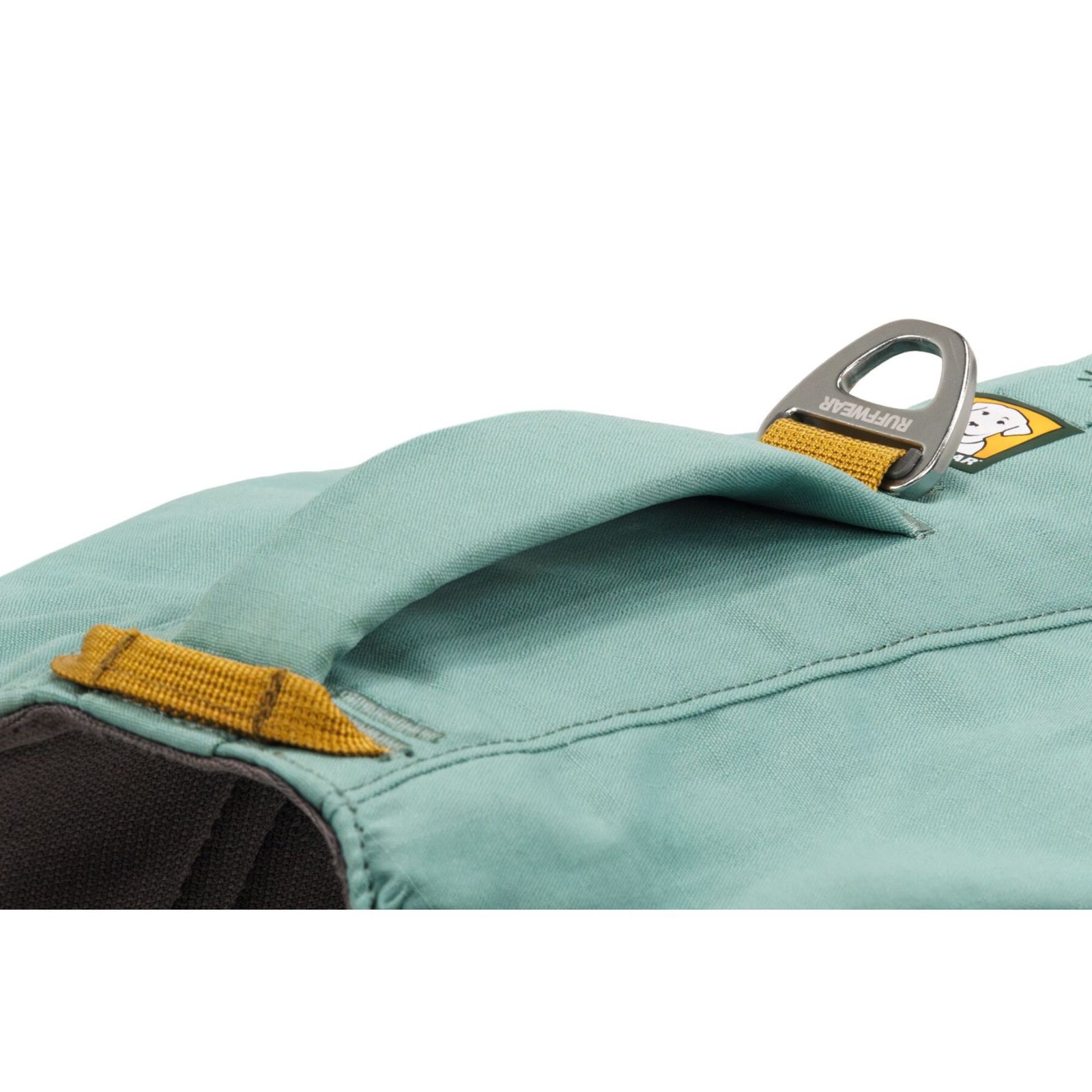 Close-up of the padded handle and aluminium V-ring on the Ruffwear Front Range Day Pack in River Rock Green, on white background.