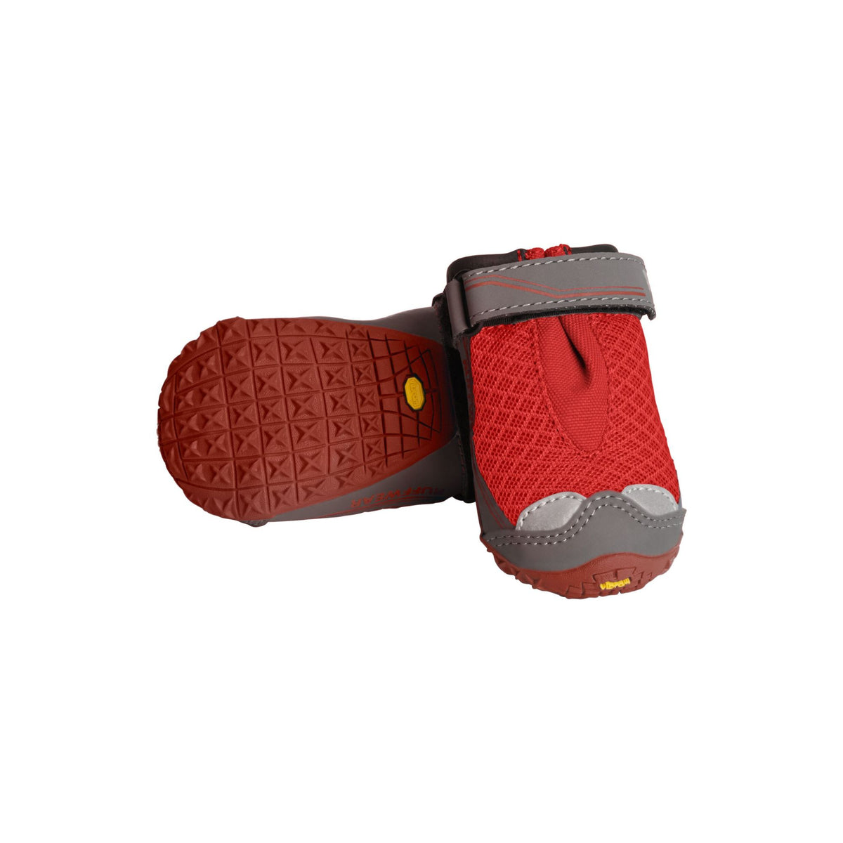 Pair of Ruffwear Grip Trex dog boots in Red Sumac, one showing the textured Vibram sole and one upright showing the mesh upper, velcro strap, and toe bumper, on white background.
