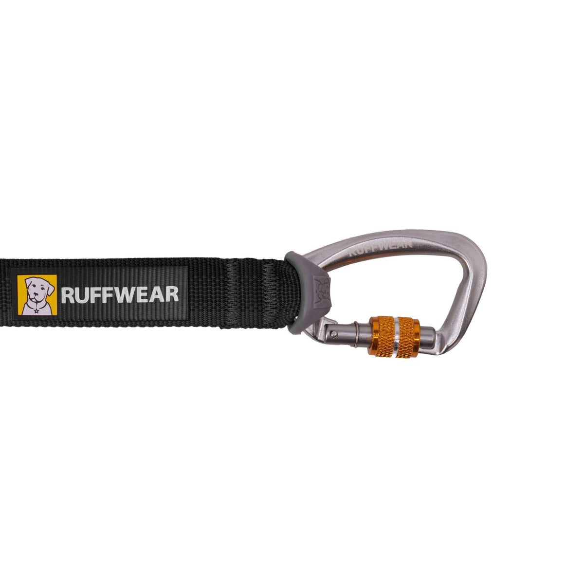 Close-up of the Ruffwear Rogue Long Line in Basalt Gray showing the anodized aluminium screwgate carabiner with orange locking collar, attached to the flat Tubelok webbing with Ruffwear logo label